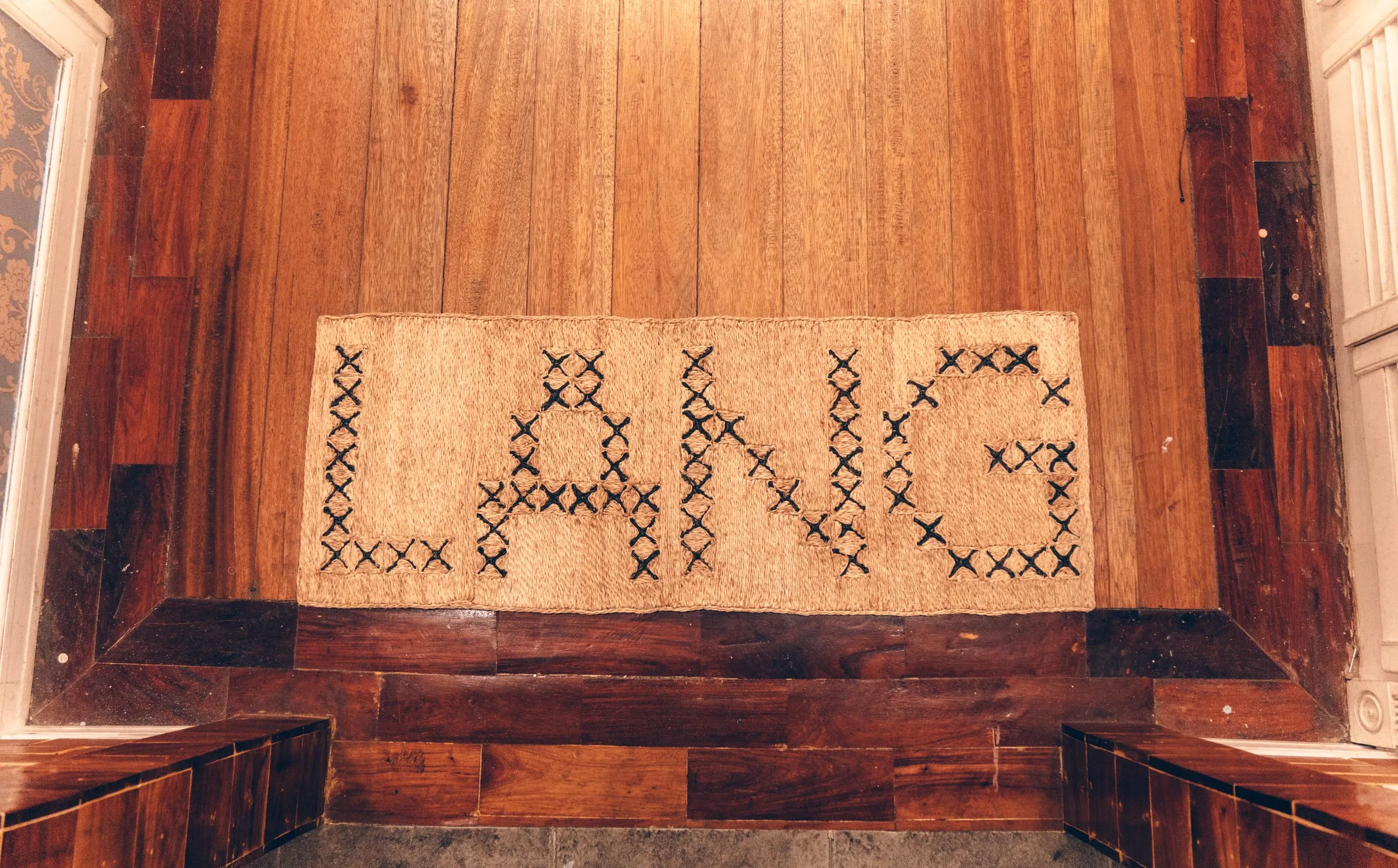 Bespoke abaca doormat woven with the word Lang