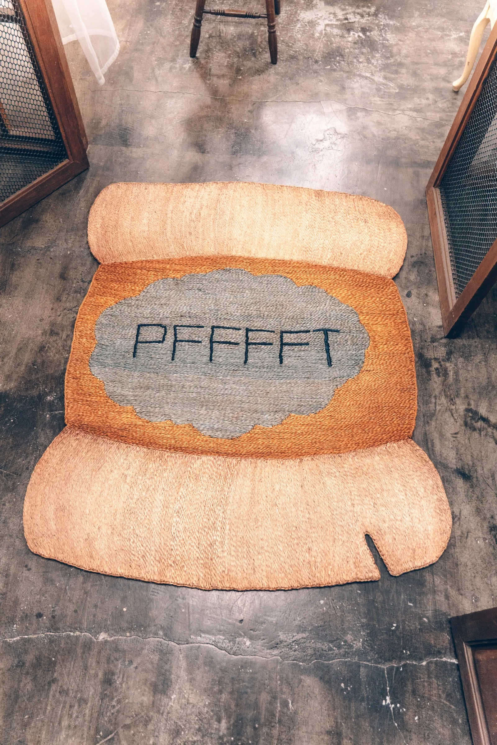 Bespoke rug woven with the word Pffft