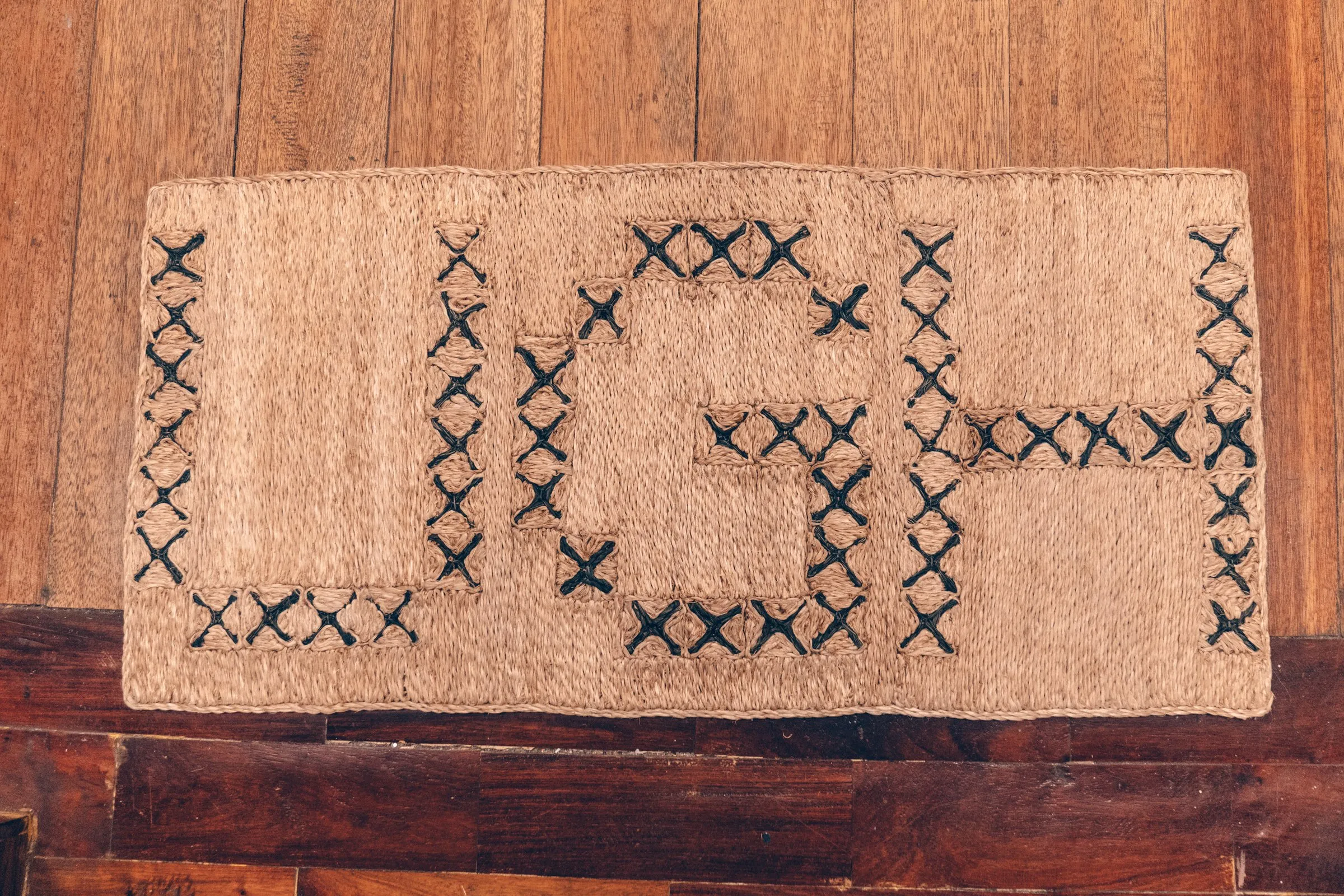 Doormat woven with the word Ugh
