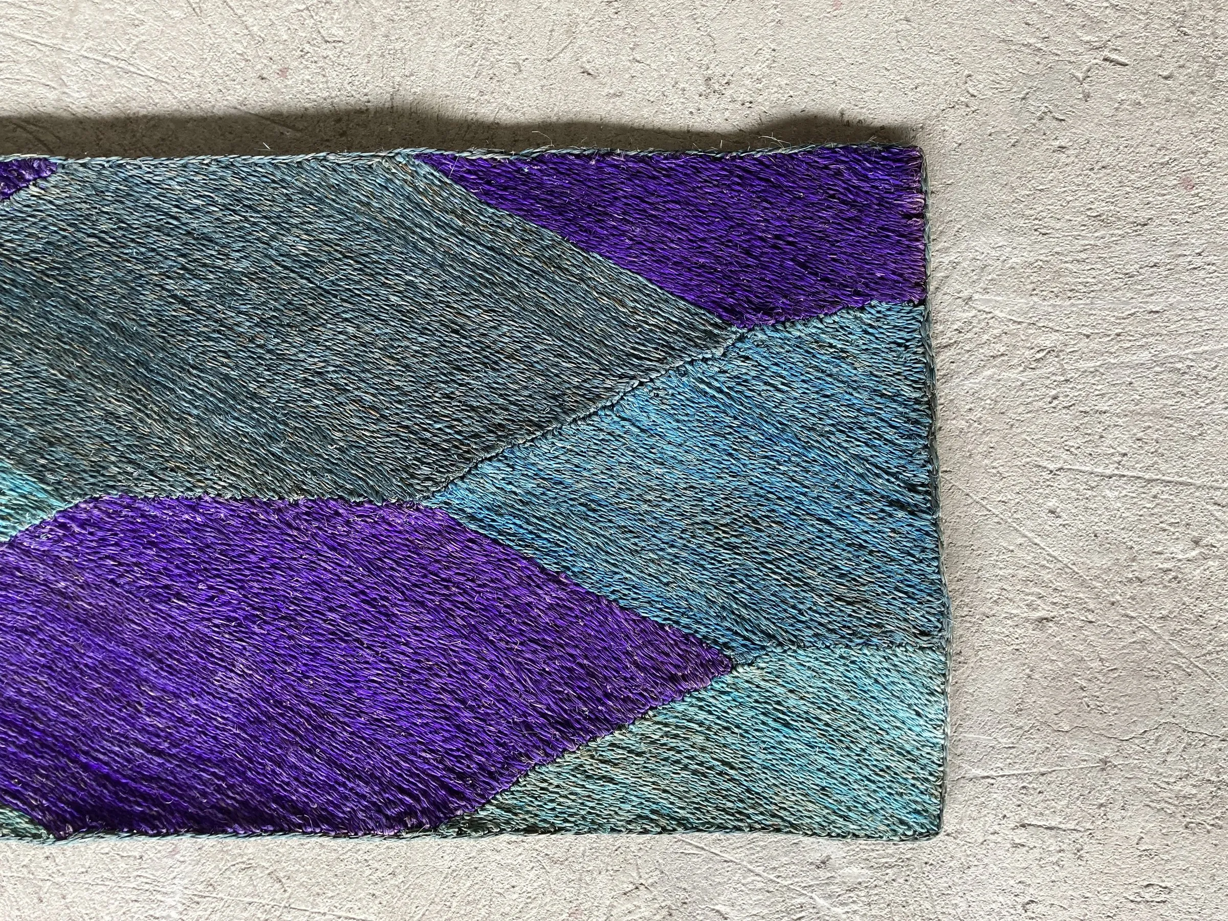 Abaca rug dyed in purple and teal diamonds