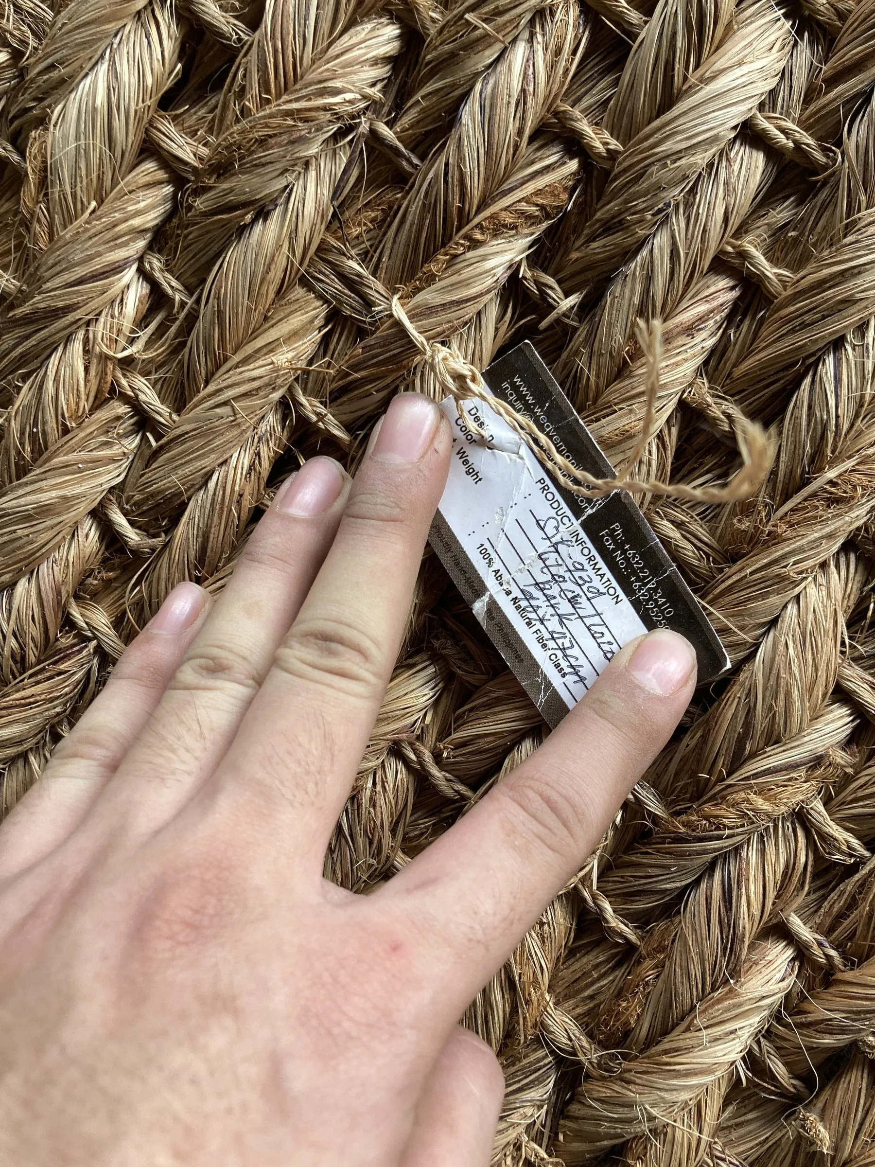 Weaver's hand on a thick abaca weave