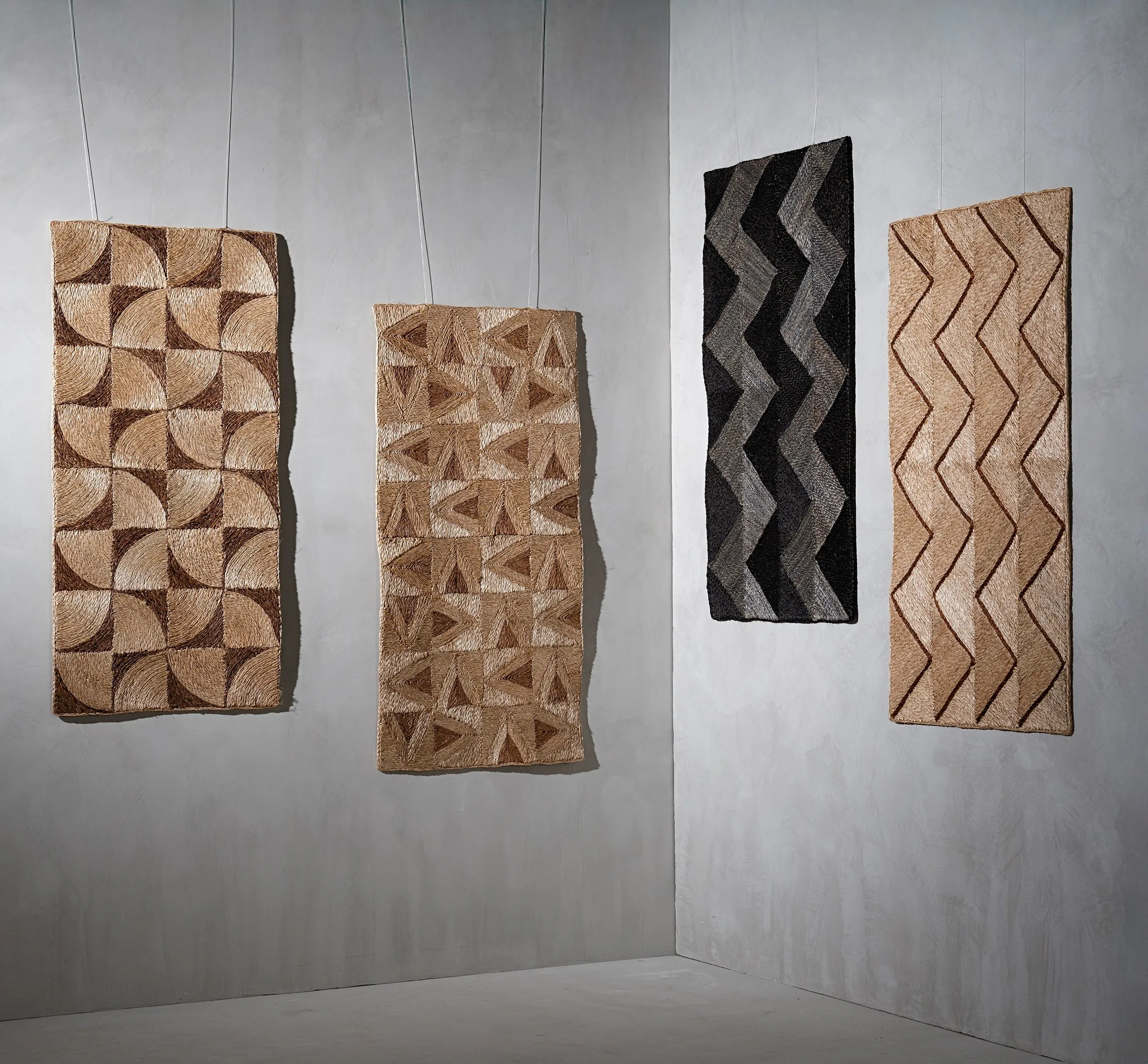 Four abaca art weave panels hanging in a gallery, photographed for Maison and Objet Paris