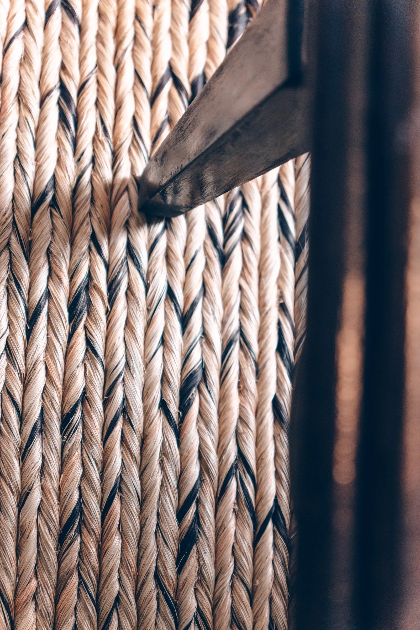 Close up of a hand braided abaca weave with black thread